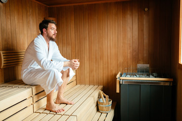 Handsome man relaxing in sauna © NDABCREATIVITY