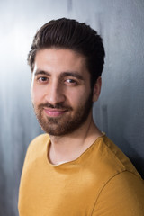 Obraz premium Portrait of a fashionable young man on dark background, chalkboa