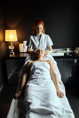 Beautiful woman enjoying massage treatment