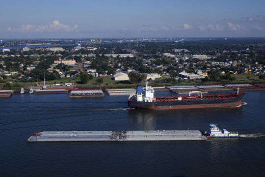 Industral tanker going around Algiers Point on the Mississippi River in New Orleans, Louisiana with Bywater, Holy Cross and Lower Ninth Ward in the background.