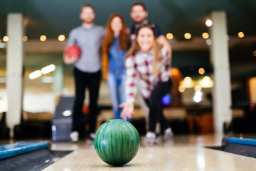 Friends having fun while bowling