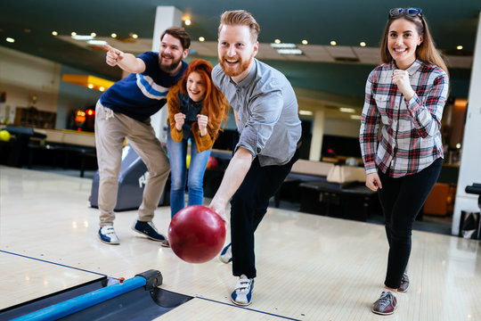 Friends having fun while bowling