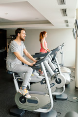 Fototapeta na wymiar People cardio exercising in gym