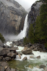 Naklejka na ściany i meble Yosemite mountains with waterfall and trees