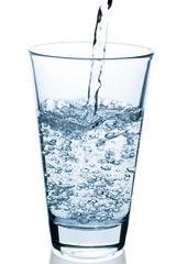 pouring bubbling water into glass
