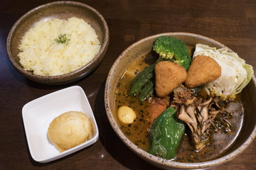 Soup Curry Chicken and Vegetables Bowl in Sapporo, Hokkaido, Japan 