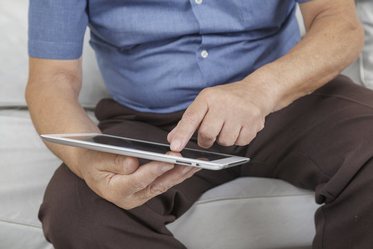 Old man using a Tablet