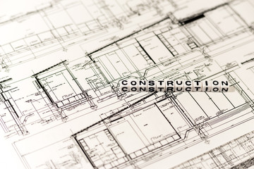 Construction drawing and CONSTRUCTION on white cube