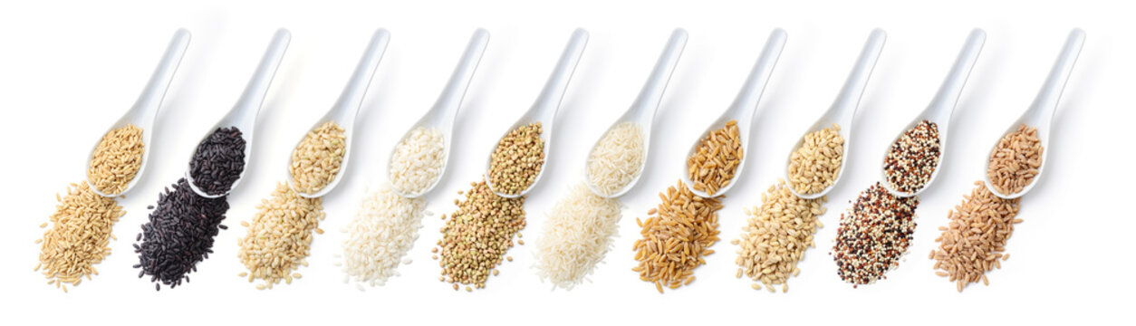 Assortment of cereals. From left: oats, black rice, brown rice, carnaroli rice, buckwheat, basmati rice, khorasan wheat, barley, quinoa, spelt. White background, top view, flat lay.
