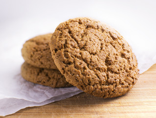 Healthy oat round cookies laying on wooden table