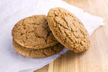 Healthy oat round cookies laying on wooden table