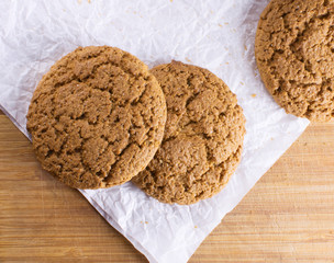 Healthy oat round cookies laying on wooden table