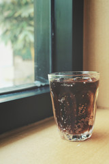 Cola with ice cubes