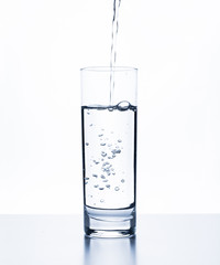 water splashing from glass isolated on white background