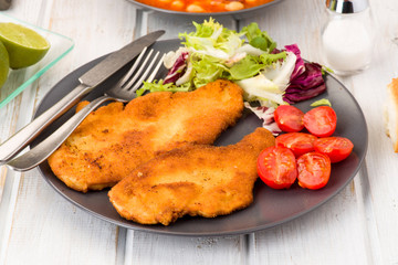 breaded fillets with salad