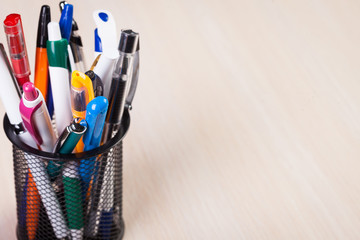 Metal holder with pens