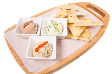 Platter with italian focaccia and various pates.
