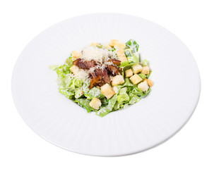 Delicious caesar salad with duck leg.