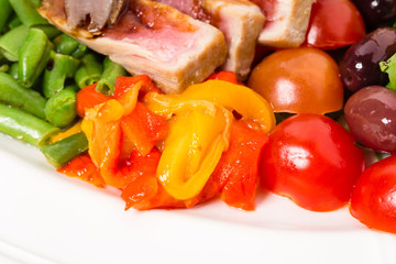 Delicious nicoise salad with tomatoes and olives. 