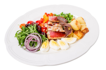 Delicious nicoise salad with baked potatoes.