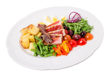 Delicious nicoise salad with baked potatoes.