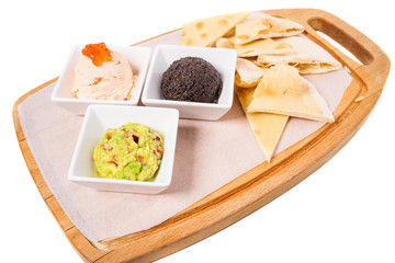 Spanish tapas platter with various pates.