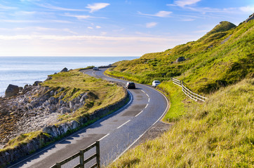The eastern coast of Northern Ireland and Antrim Coastal road with cars - 108014311