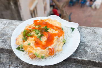 Rice omelet with chili sauce