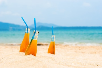 Three Orange Juice Bottles Summer Holiday Concept
