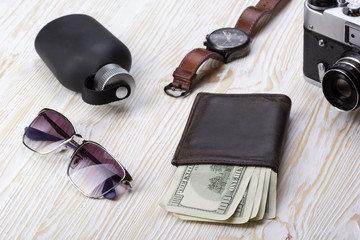 gentlemanly set:  sunglasses, perfume, wallet,camera, watch on wooden background