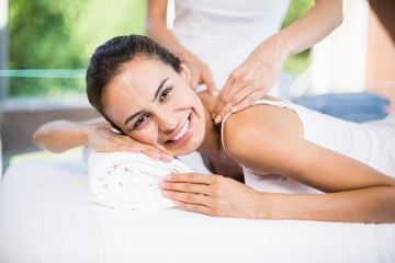 Obraz na płótnie Canvas Portrait of happy woman receiving massage