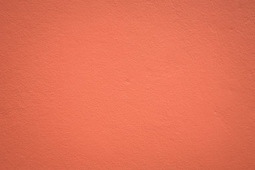 Orange color paint on concrete wall:Close up,select focus with shallow depth of field:Macro shot.