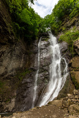 Fototapeta na wymiar small waterfall in mountains