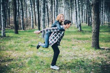 Young couple in love walking at the spring park