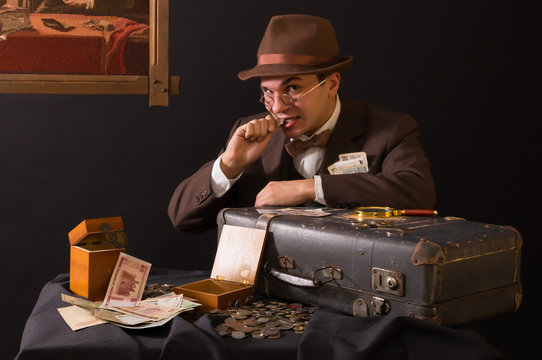 Numismatist with his coin collection