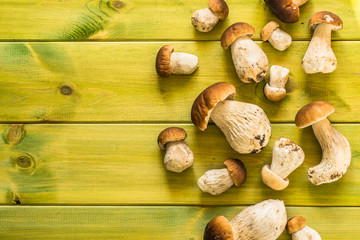 Boletus mushrooms, fresh, whole on wooden table.
