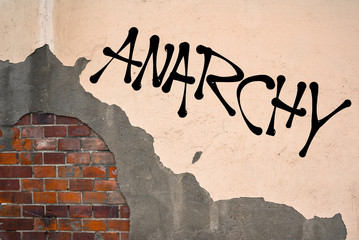 Handwritten graffiti Anarchy sprayed on the wall, anarchist aesthetics