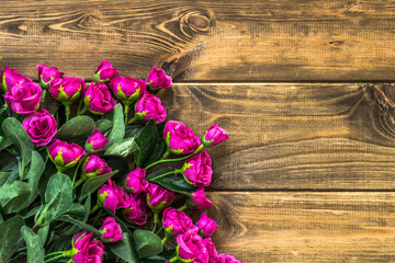 Valentines day roses on wooden background