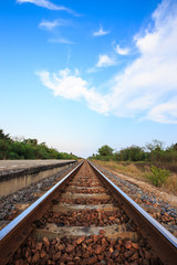 Fototapeta na wymiar Railway tracks with blue sky in the evening