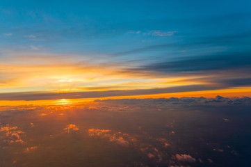 Heavenly Golden Morning Sun & Beautiful Cloudy sky on sky from airplane Through window - flying view (window airplane)
