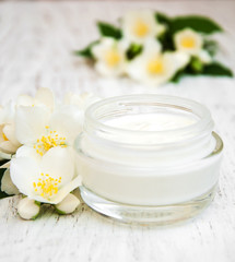 Fototapeta na wymiar face and body cream moisturizers with jasmine flowers