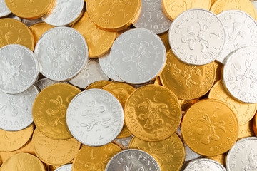 Gold and silver, chocolate coins filling the frame.