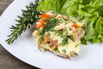 Meat covered cheese and tomato