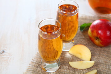 Apple juice and fresh red apples