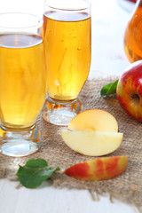 Apple juice and fresh red apples