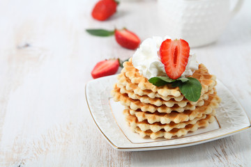 Waffles, mint and ripe strawberries