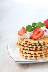Waffles, mint and ripe strawberries