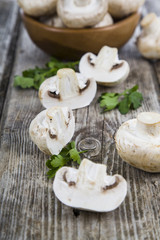 Fototapeta na wymiar Raw mushrooms on a wooden table