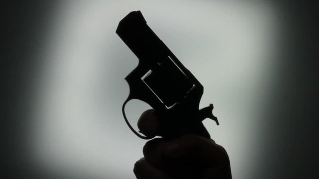 black silhouette gun. Handheld revolver gun