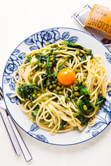 Italian pasta carbonara. vegetarian style with spinach and peas.